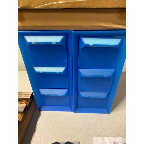 293 - 2 plastic storage drawers along with 3 new plant rollers.