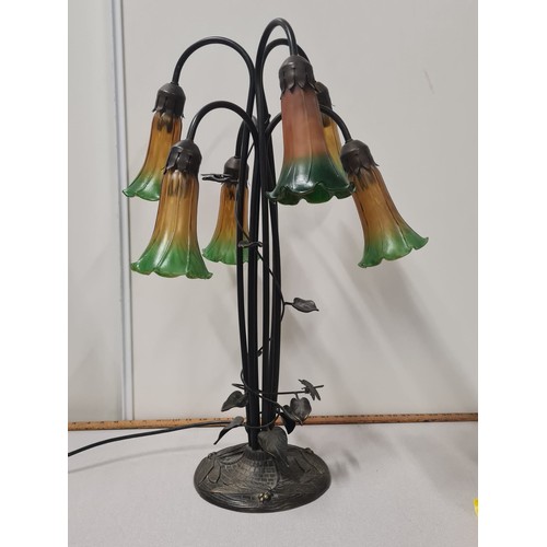 16 - Art Nouveau style six arm lamp with amber and green glass lily shades.
64cm h