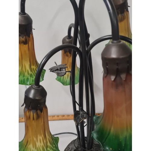 16 - Art Nouveau style six arm lamp with amber and green glass lily shades.
64cm h