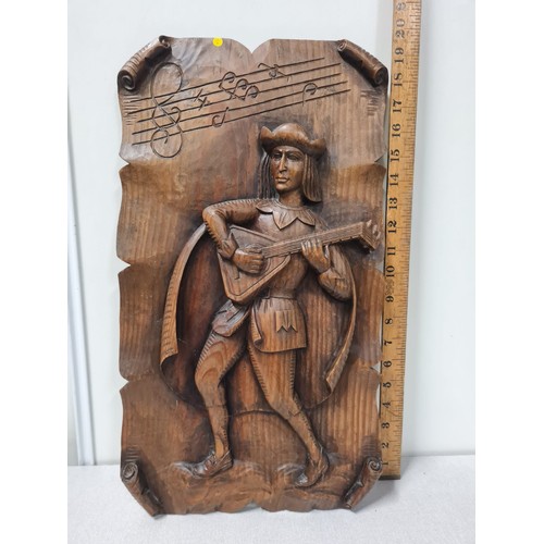 10 - Vintage carved wooden wall plaque of man playing lute.
51cm x 29cm