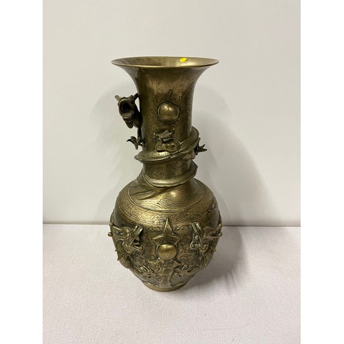 37 - Oriental bronze vase with dragon decoration with markings to the base.
39cm h