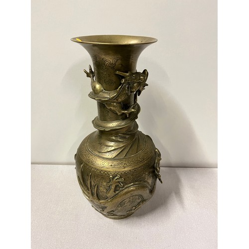 37 - Oriental bronze vase with dragon decoration with markings to the base.
39cm h