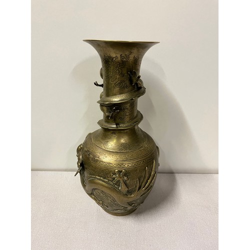 37 - Oriental bronze vase with dragon decoration with markings to the base.
39cm h