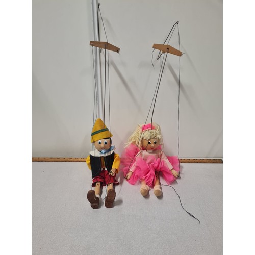 51 - 2 vintage wooden puppets to include Pinocchio.
Tallest 69cm