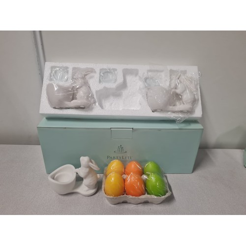 52 - Set of 6 Partylite egg candles along with 3 rabbit candle holders.