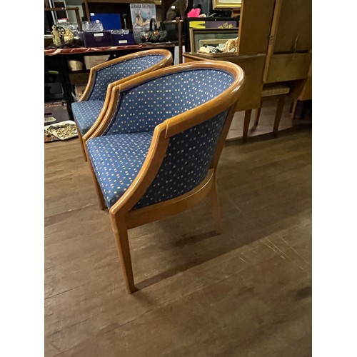 70 - Pair of oak framed bucket chairs.