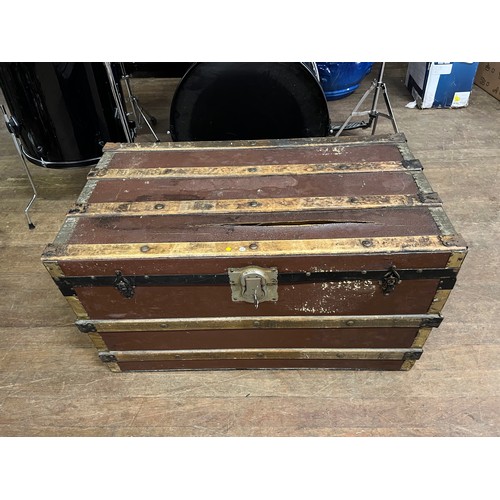 85 - Large antique wood banded travel trunk with key.
83cm long x 47cm high x 47cm deep.