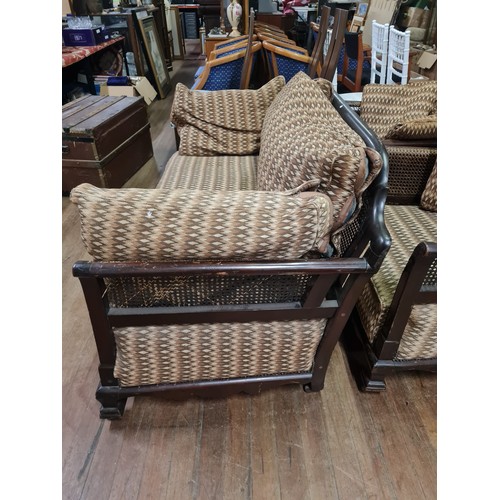 88 - 3 piece wood and rattan framed suite - 2 x arm chairs and 2 seater sofa. (small piece of rattan need... 