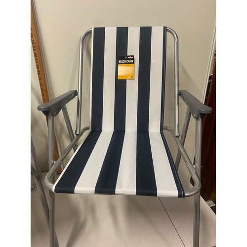 304 - 2 new folding beach chairs.