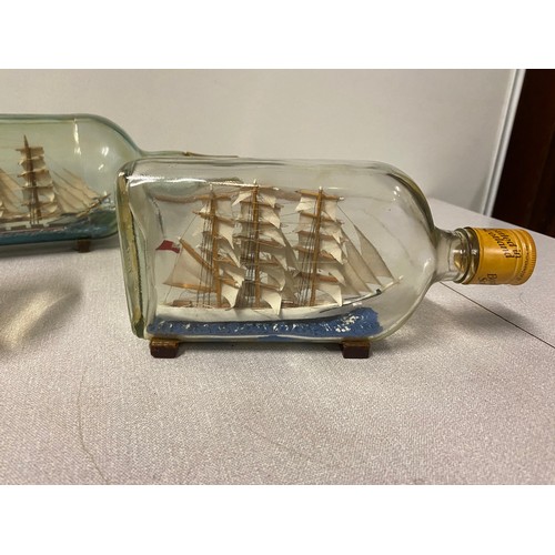 110 - Collection of 5 glass ships in bottles. 2 signed Jamieson 1977/78