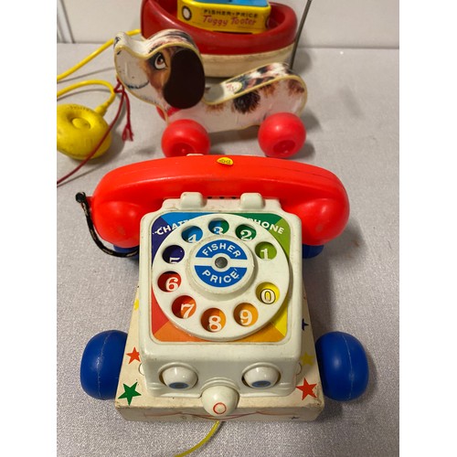 317 - 3 vintage Fisher Price toys - Tuggy Tooter, pull along dog and telephone.