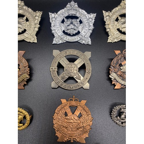 53 - Collection of 11 military cap badges to include Calgary Highlanders and Argyle and Sutherland.