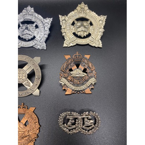 53 - Collection of 11 military cap badges to include Calgary Highlanders and Argyle and Sutherland.