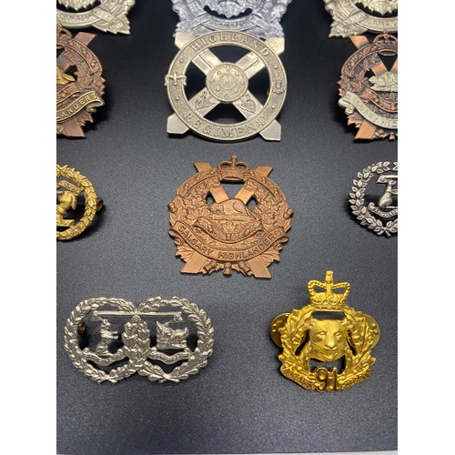 53 - Collection of 11 military cap badges to include Calgary Highlanders and Argyle and Sutherland.