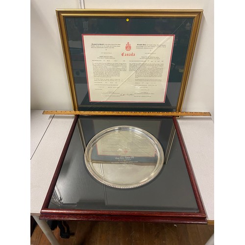 452 - Canadian Armed Forces discharge paper in gilt frame along with framed military retirement plated tra... 