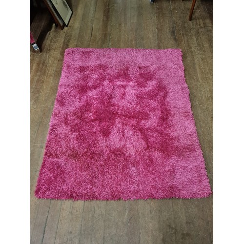 515 - Pink floor rug.