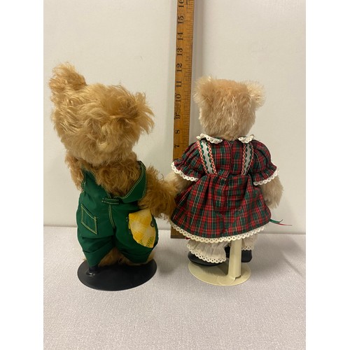 82 - 2 Franklin Mint jointed teddy bears on stands John Deere and Holly the holiday dress maker.