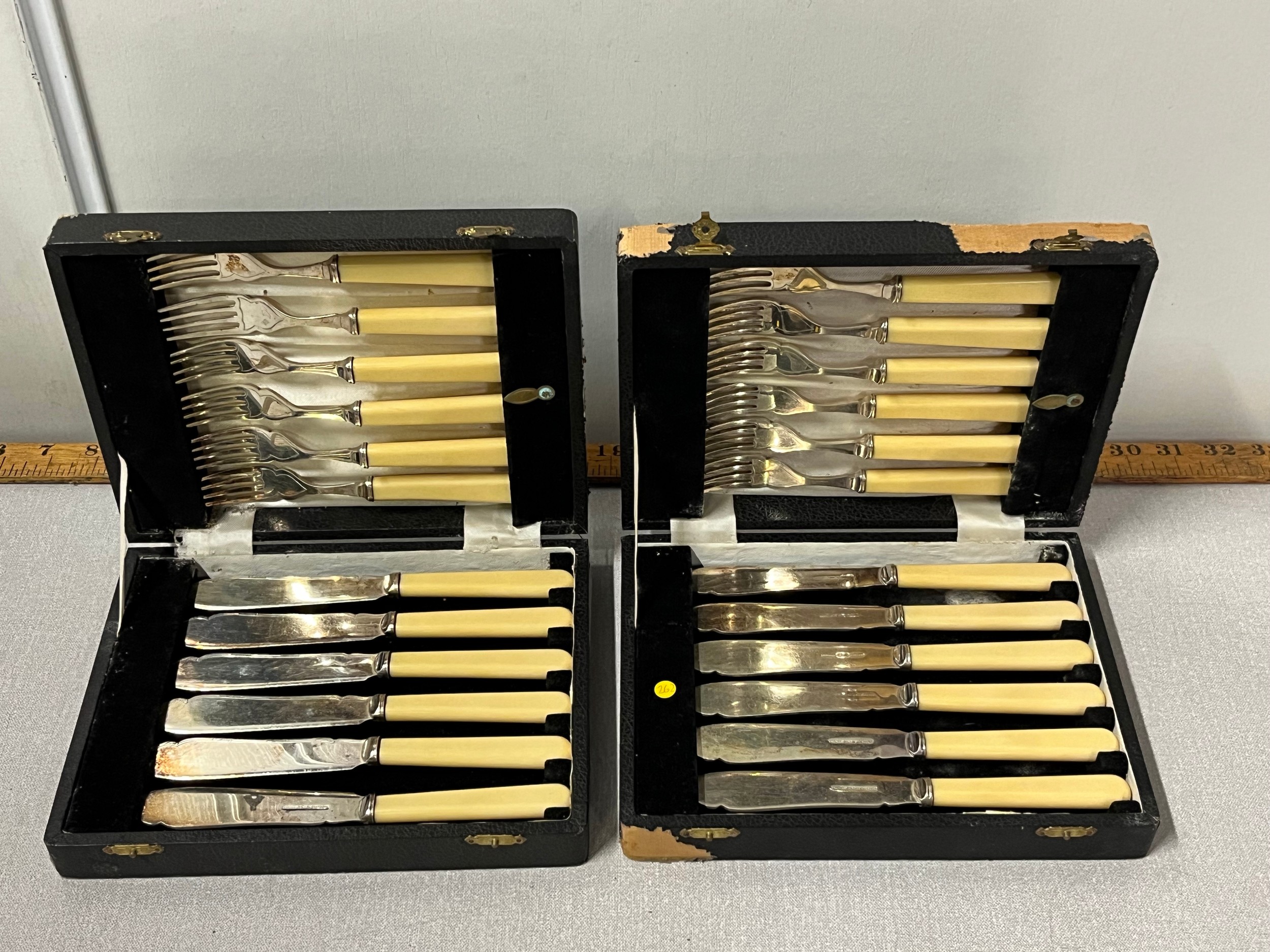 2 sets of vintage cutlery in original cases.