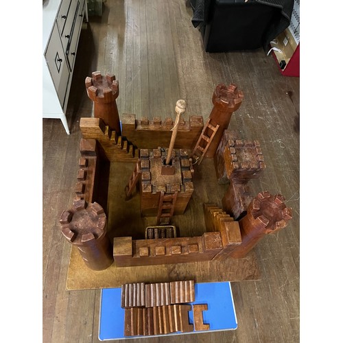 128 - Large solid wooden hand crafted kids fort/castle. Comes in large solid wood chest.
Fort approx 100cm... 