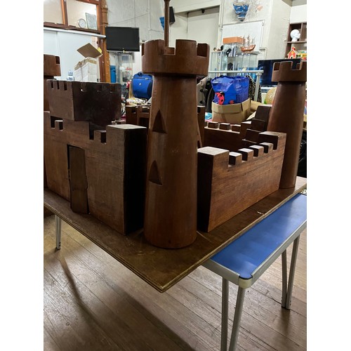 128 - Large solid wooden hand crafted kids fort/castle. Comes in large solid wood chest.
Fort approx 100cm... 