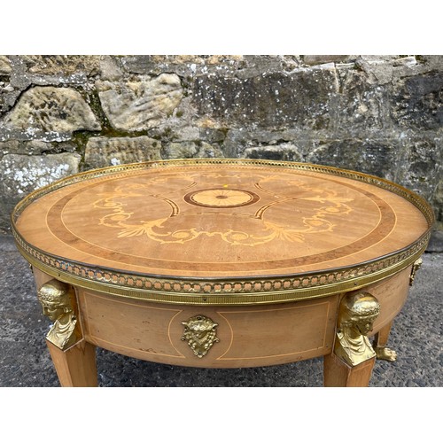 133 - Vintage French inlaid coffee table with brass gallery with five legs on lion feet.
85cm diameter x 4... 