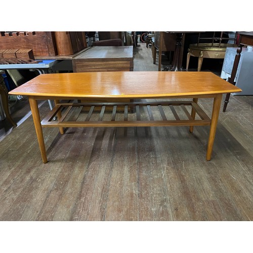 348 - Mid century teak coffee table with ladder shelf. Possibly Danish.