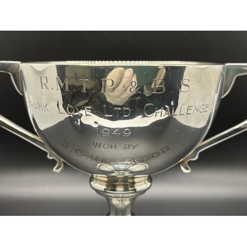 4 - Hallmarked solid silver two handled golf trophy cup dated 1949.
197g
14.5cm h