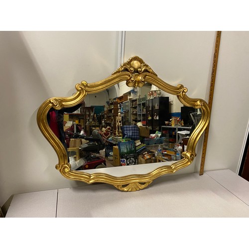 23 - Ornate gilt framed wall mirror.
90cm l