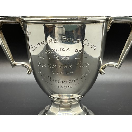 24 - Hallmarked solid silver two handled trophy cup. Dated 1933.
169g
9.5cm h