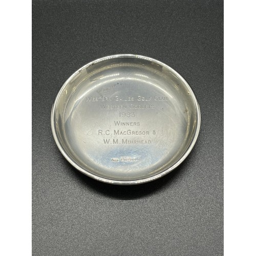 25 - Hallmarked silver presentation dish. Dated 1983.
58g
8cm diameter