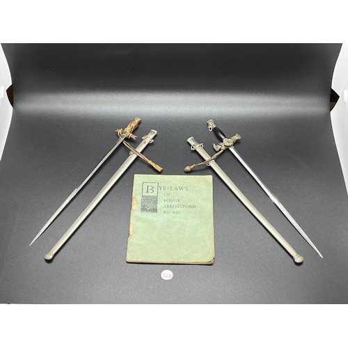 30 - Pair of Masonic miniature swords and sheaths along with bye-laws of lodge abbotsford booklet.