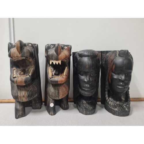 34 - Two sets of vintage carved African bookends.