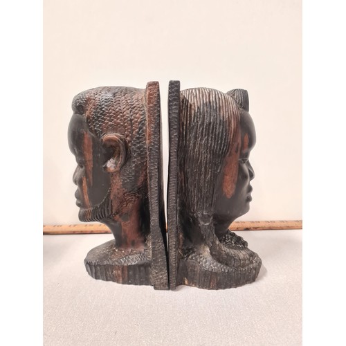 34 - Two sets of vintage carved African bookends.