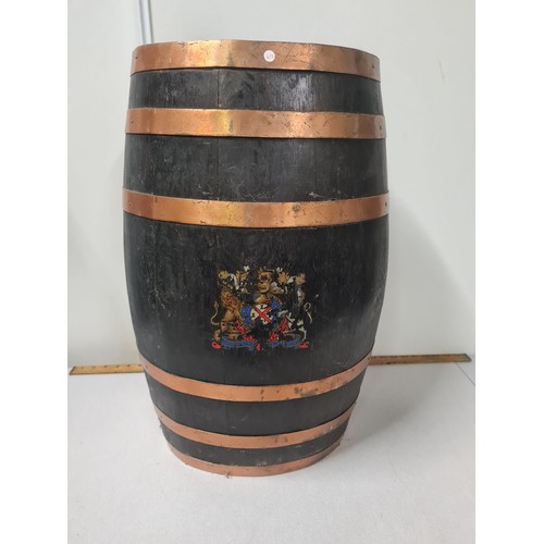 39 - 19th century brass bound oval oak barrel stick stand decorated with coat of arms.
82cm h