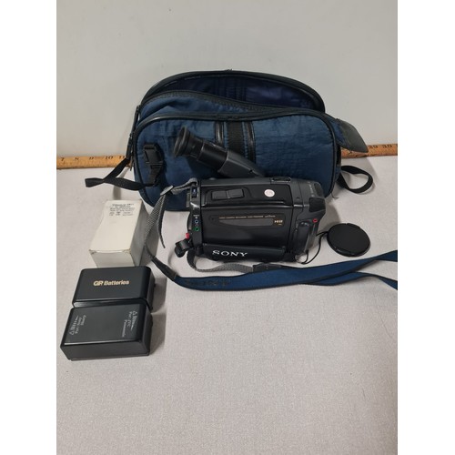 512 - Sony video camera, batteries and case.