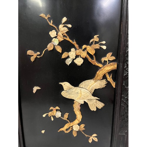 15 - pair of black lacquered  oriental pictures with bird carvings
38cm x 55cm