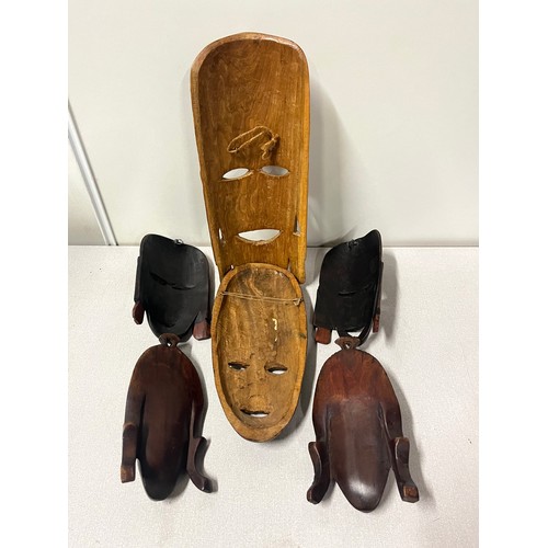 167 - selection of carved wooden masks