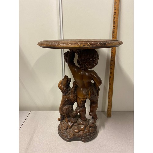 178 - Plastic occasional table with cherub & dog.
56cm h