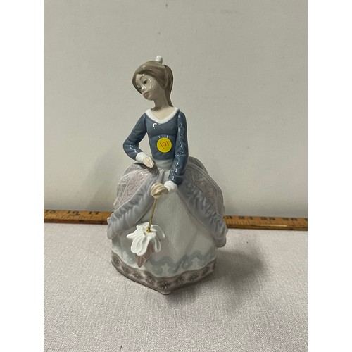 63 - Lladro lady figurine holding umberella. 
17cm h