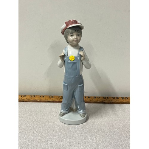 64 - Lladro boy with accordion. 
22cm h