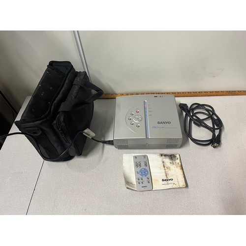 212 - Sanyo pro xtrax multiverse projector with remote & instructions.