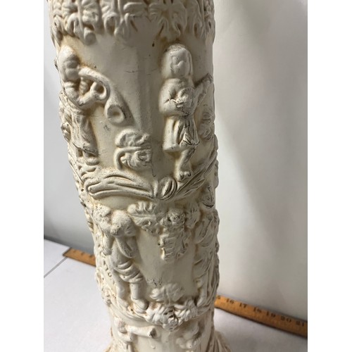 313 - Ceramic column with cherubs.  
64cm h