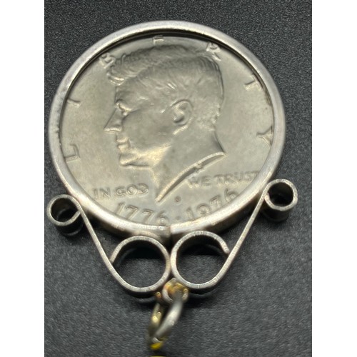 12 - silver half dollar with hallmarked silver mount. 
15.63g