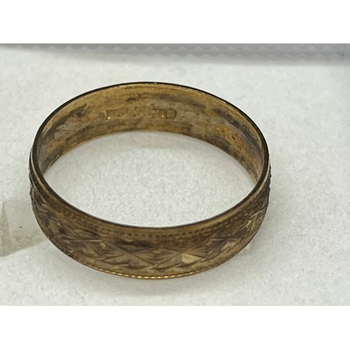 17 - 9ct gold engraved ring.