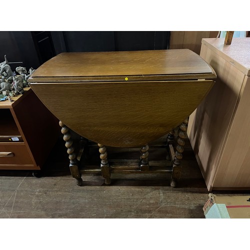 332 - Oak barley twist drop leaf table.