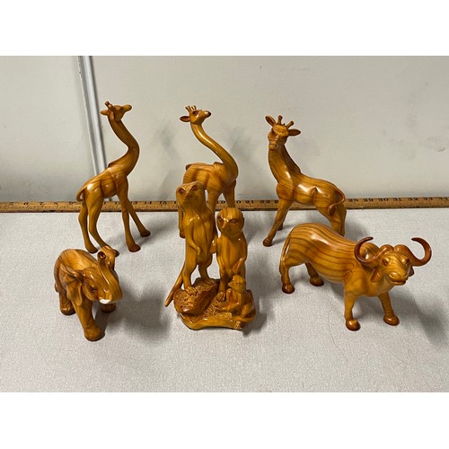 81 - Collection of hand carved wooden animals to include meerkats and bull etc