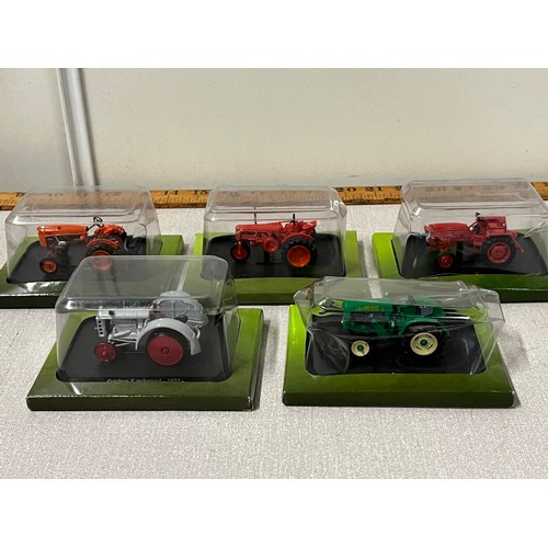 232 - 5 boxed diecast tractors