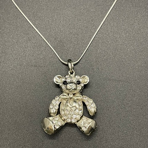 229 - Silver chain with gem encrusted teddy