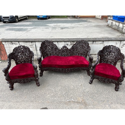 384 - an asian highly carved sofa & 2 chairs with red velvet upholstery