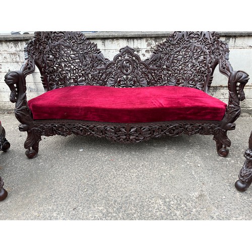 384 - an asian highly carved sofa & 2 chairs with red velvet upholstery